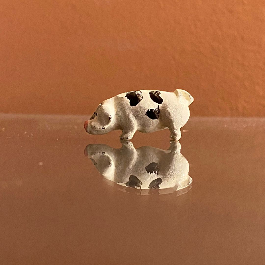 Miniature painted metal potbelly spotted pig