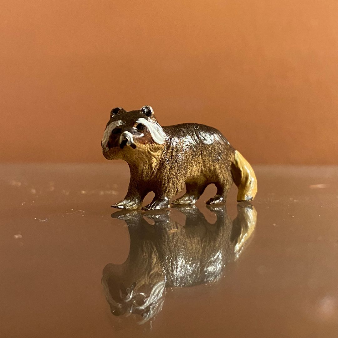 painted metal raccoon miniature Front