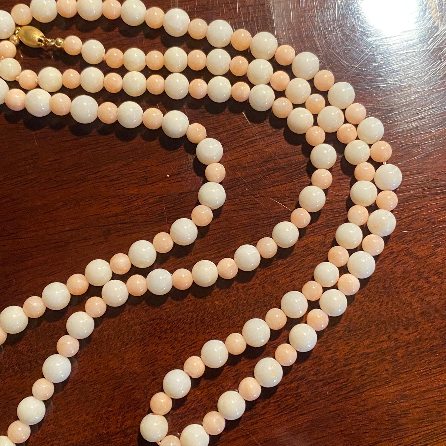 Long strand pink and white coral beaded necklace