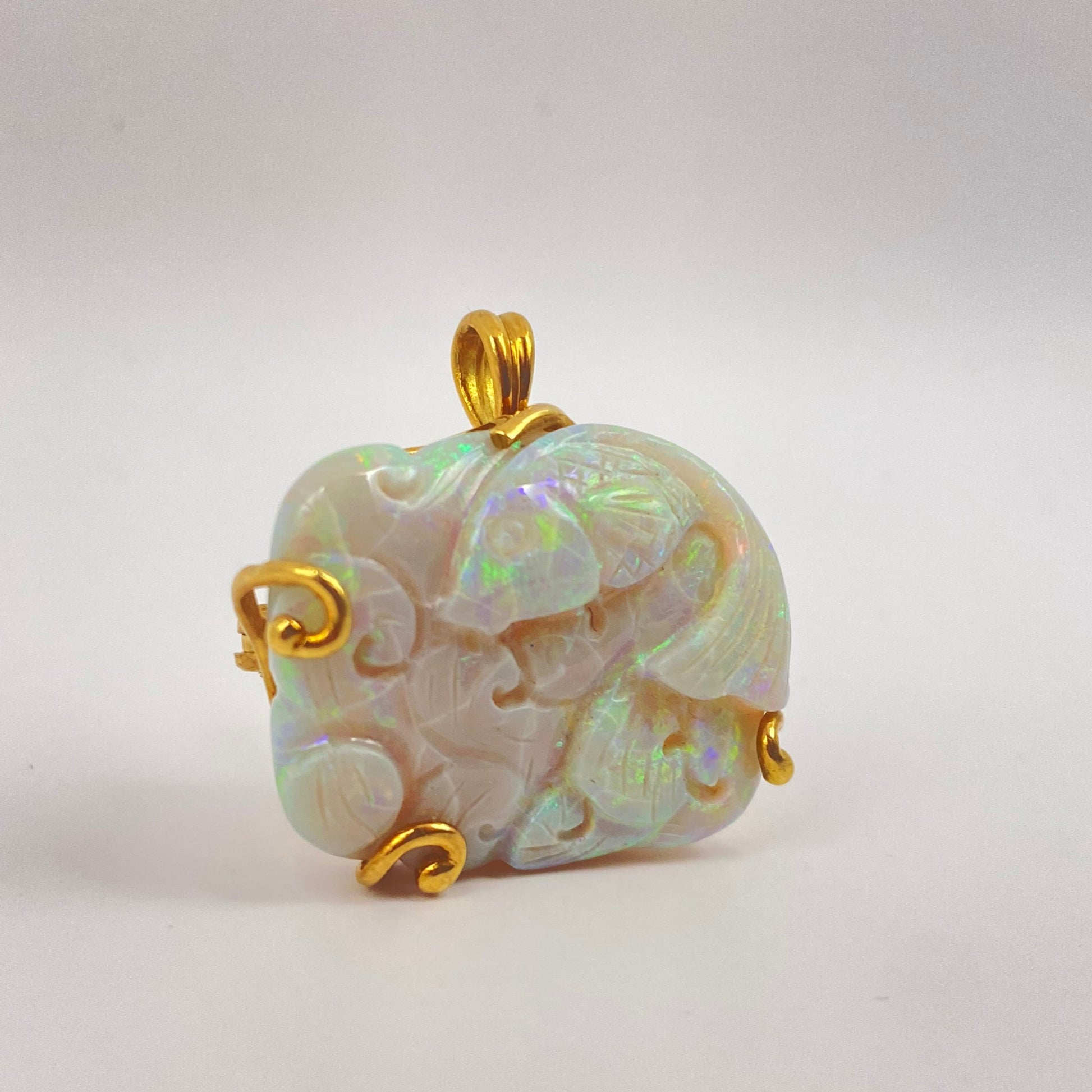 Carved Opal and Gold Fish Pendant