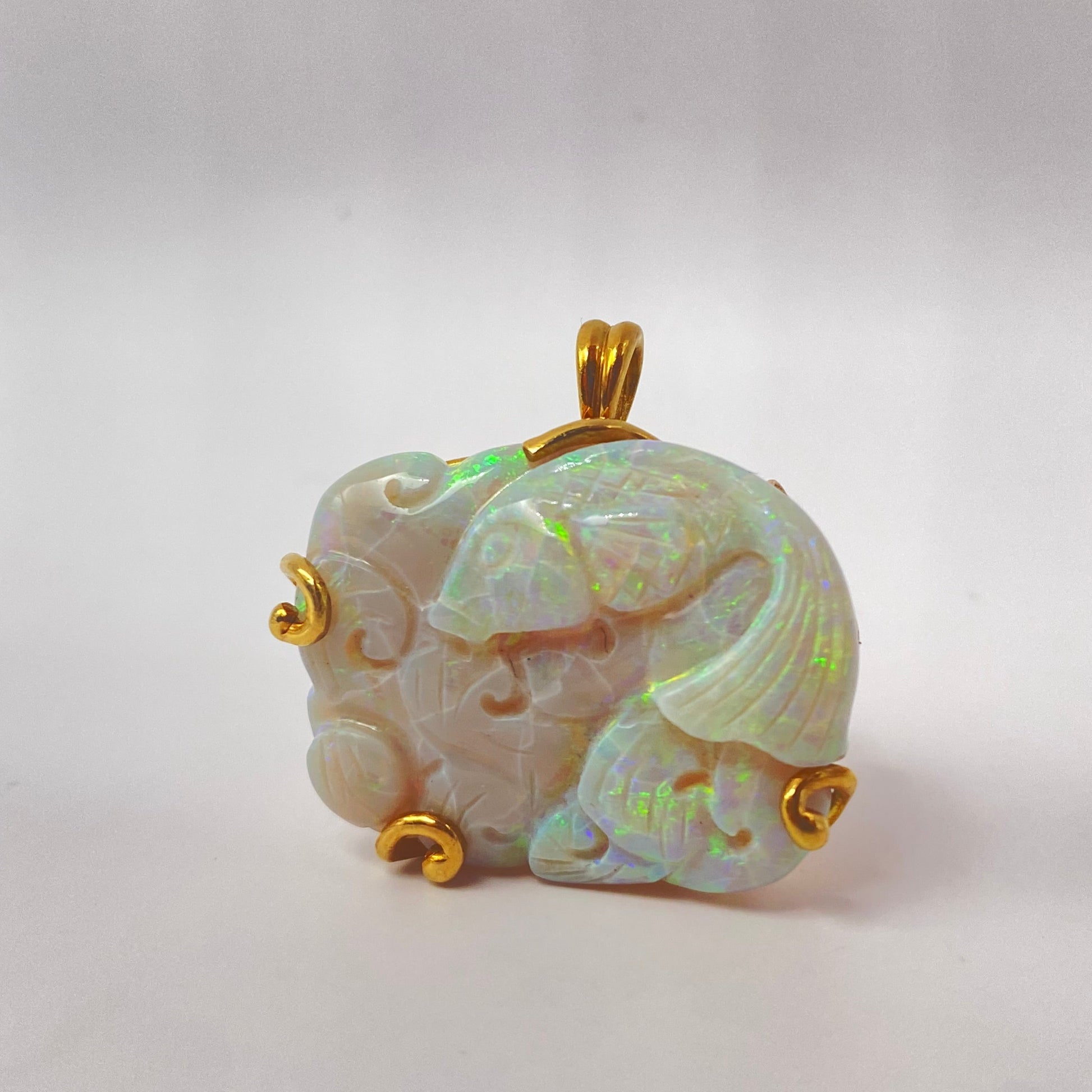 Carved Opal and Gold Fish Pendant