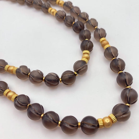 Close up Smokey quartz and gold vintage necklace 