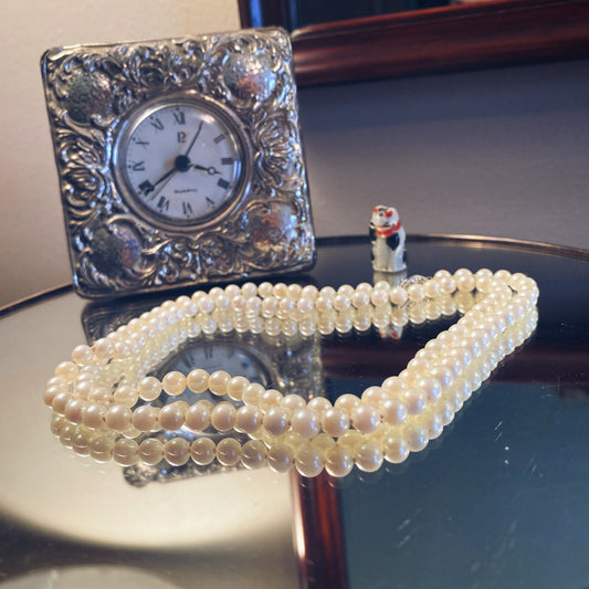 Long strand vintage faux pearl necklace with gold clasp 