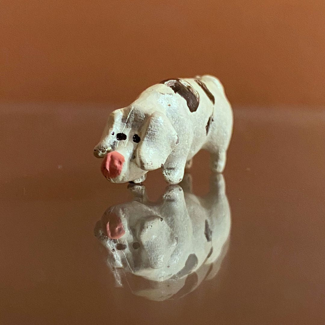 Miniature painted metal potbelly spotted pig close up 