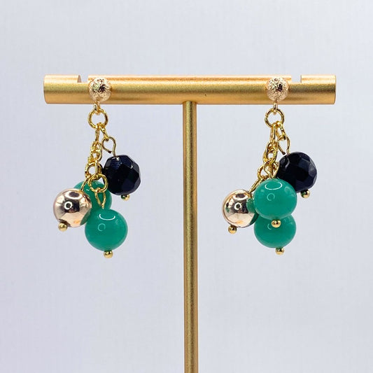 Vintage reclaimed gold plated earrings Close up teal black and gold 
